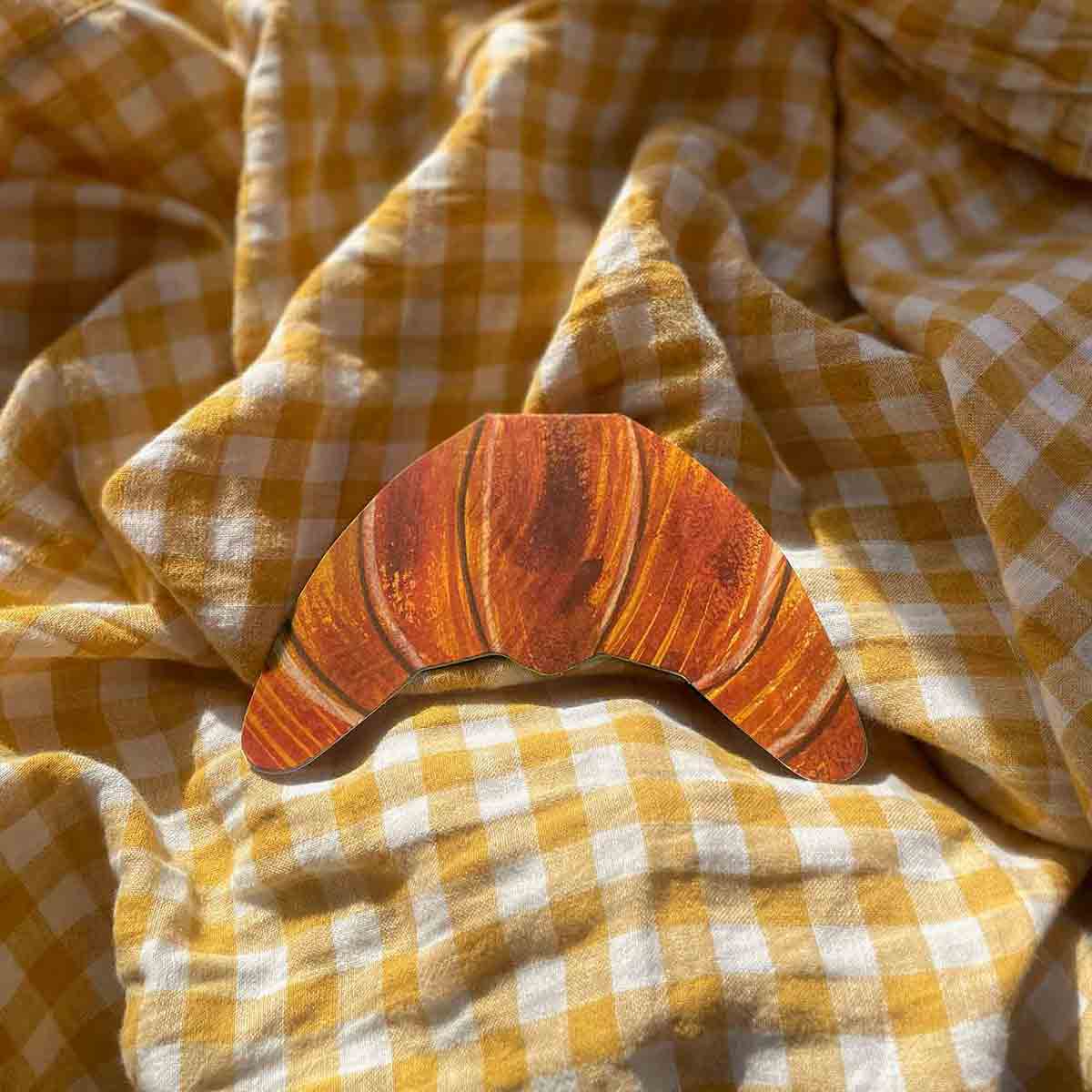 Croissant-shape-card-on-yellow-gingham-background