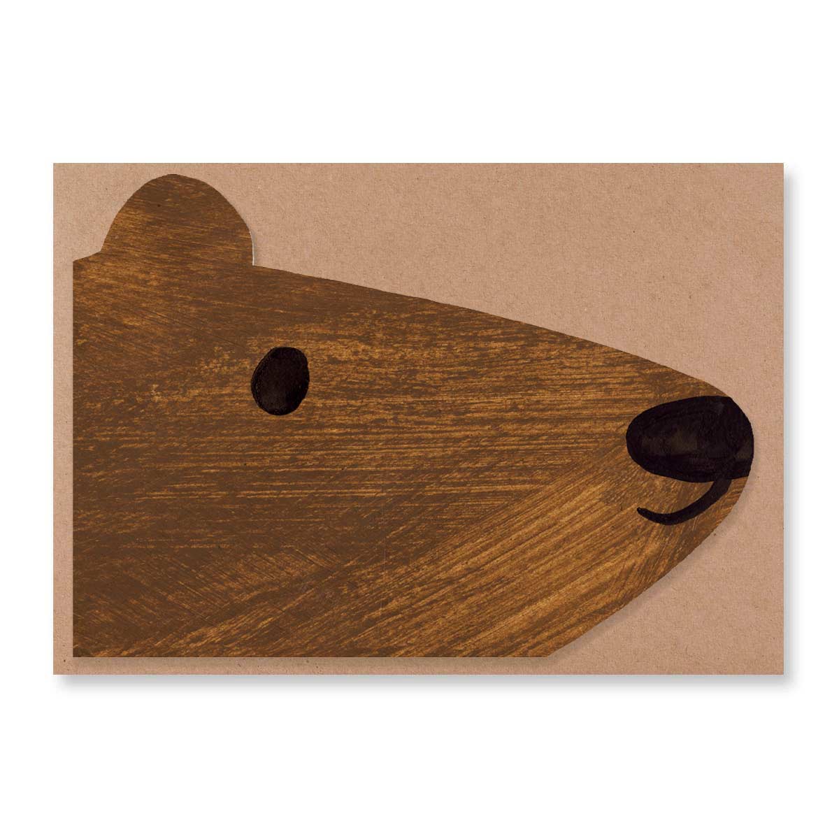 Brown bear shaped card with 100% recycled brown paper vegan envelope flat lay against a white background