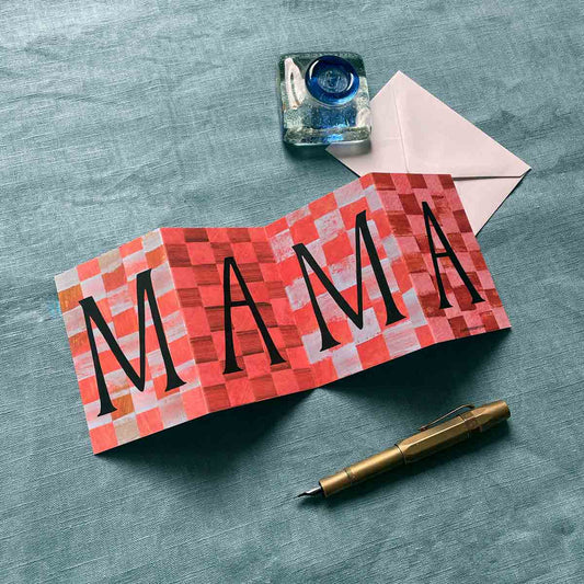 Beautifully designed Mama Concertina Card, opened to reveal its full artwork displayed on a blue background with a fountain pen