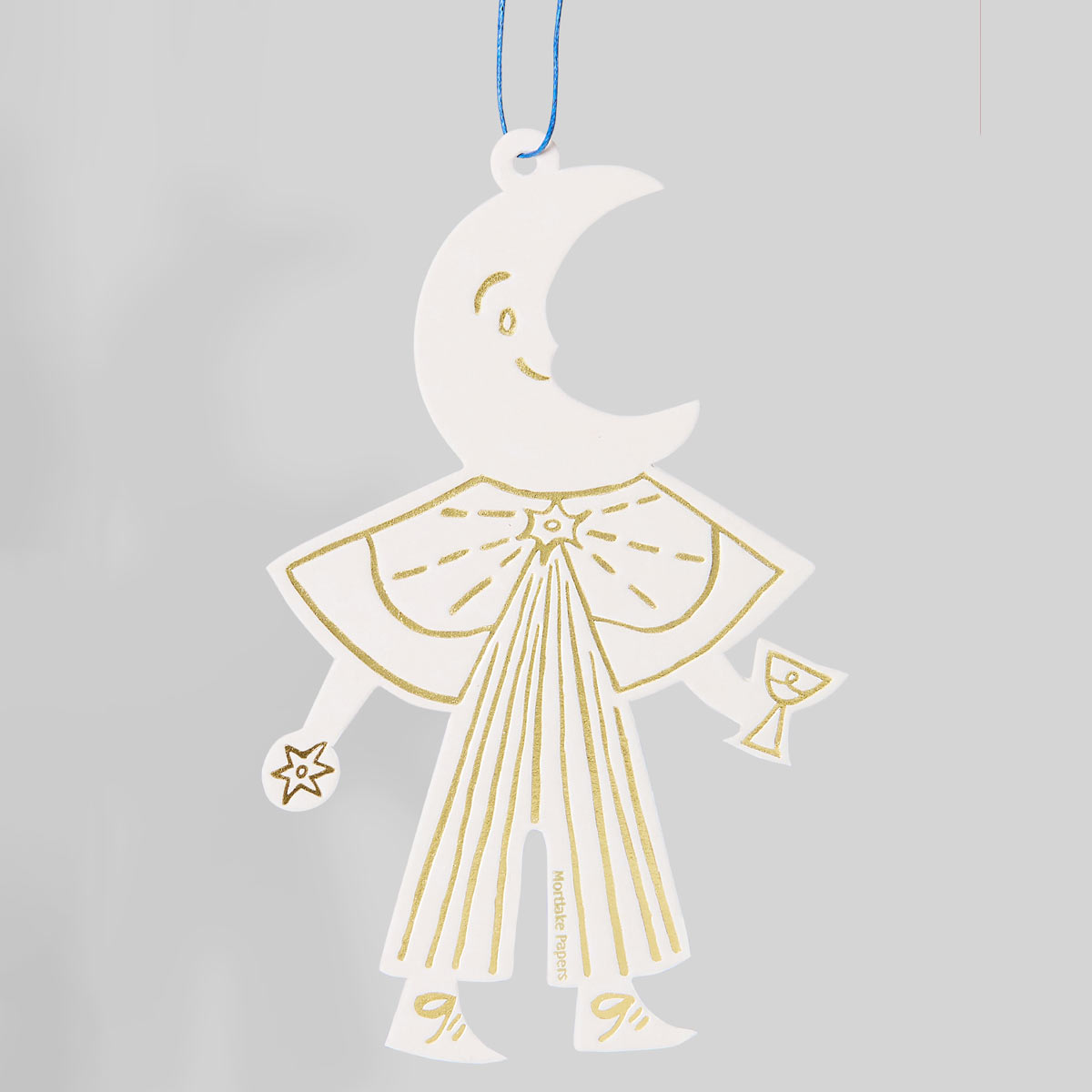 Decorative hanging figure with a crescent moon head and gold lines on a gray background
