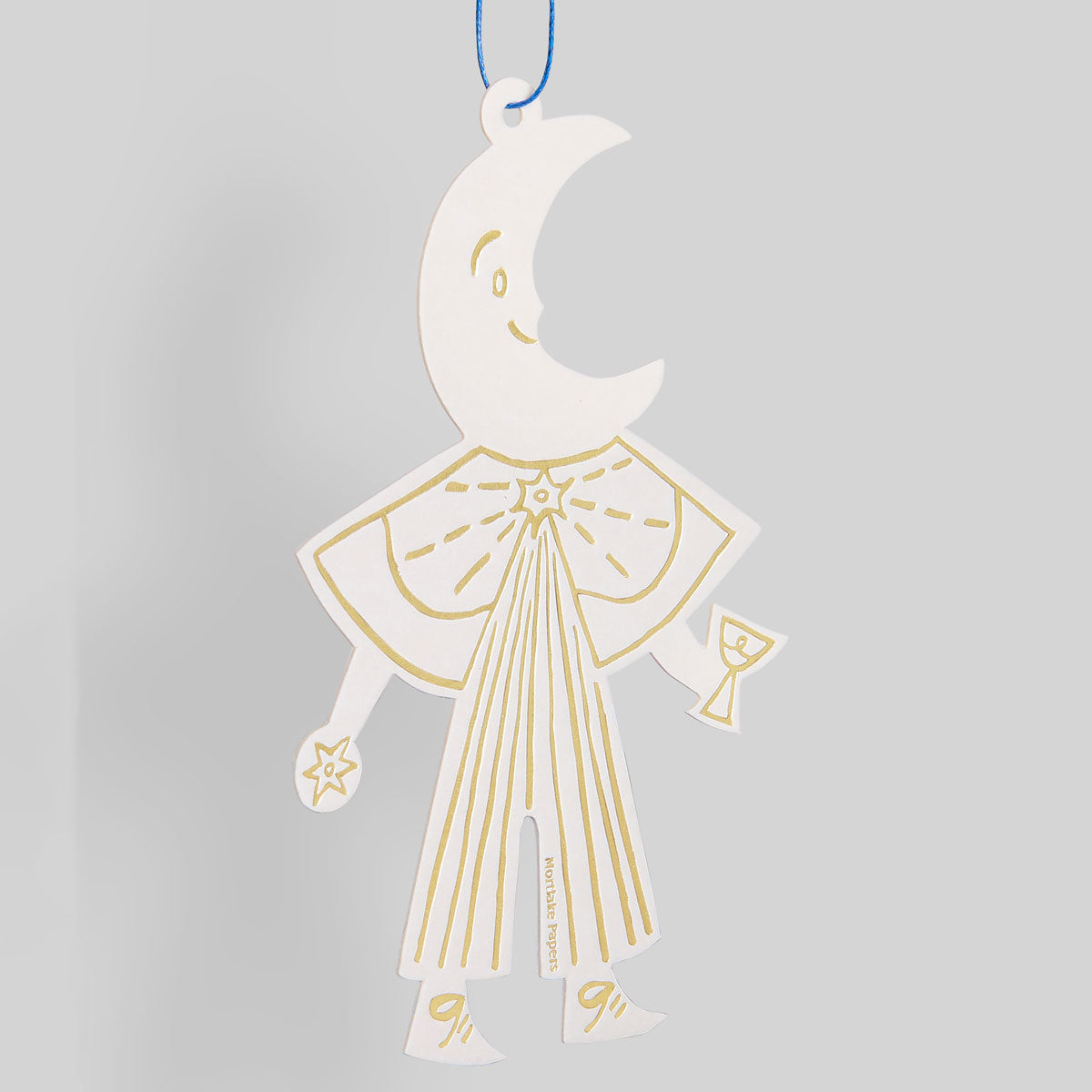 Decorative hanging ornament with a moon design on a gray background