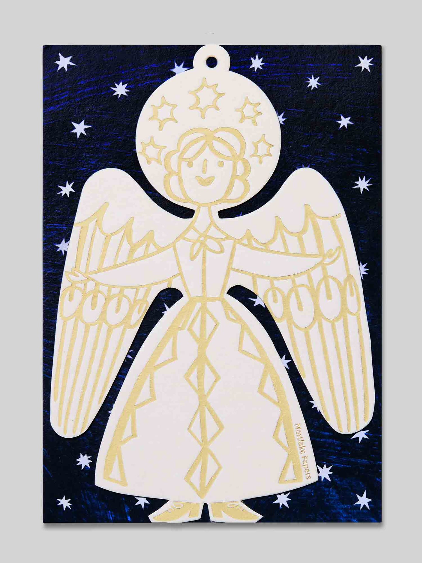 Decorative angel ornament with in gold and white on a blue starry eco-friendly packaging