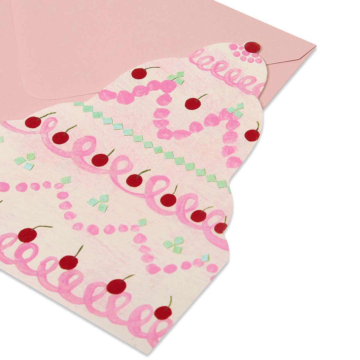 Die cut tiered cake greetings card with pink looped icing red cherries on a blush pink envelope.
