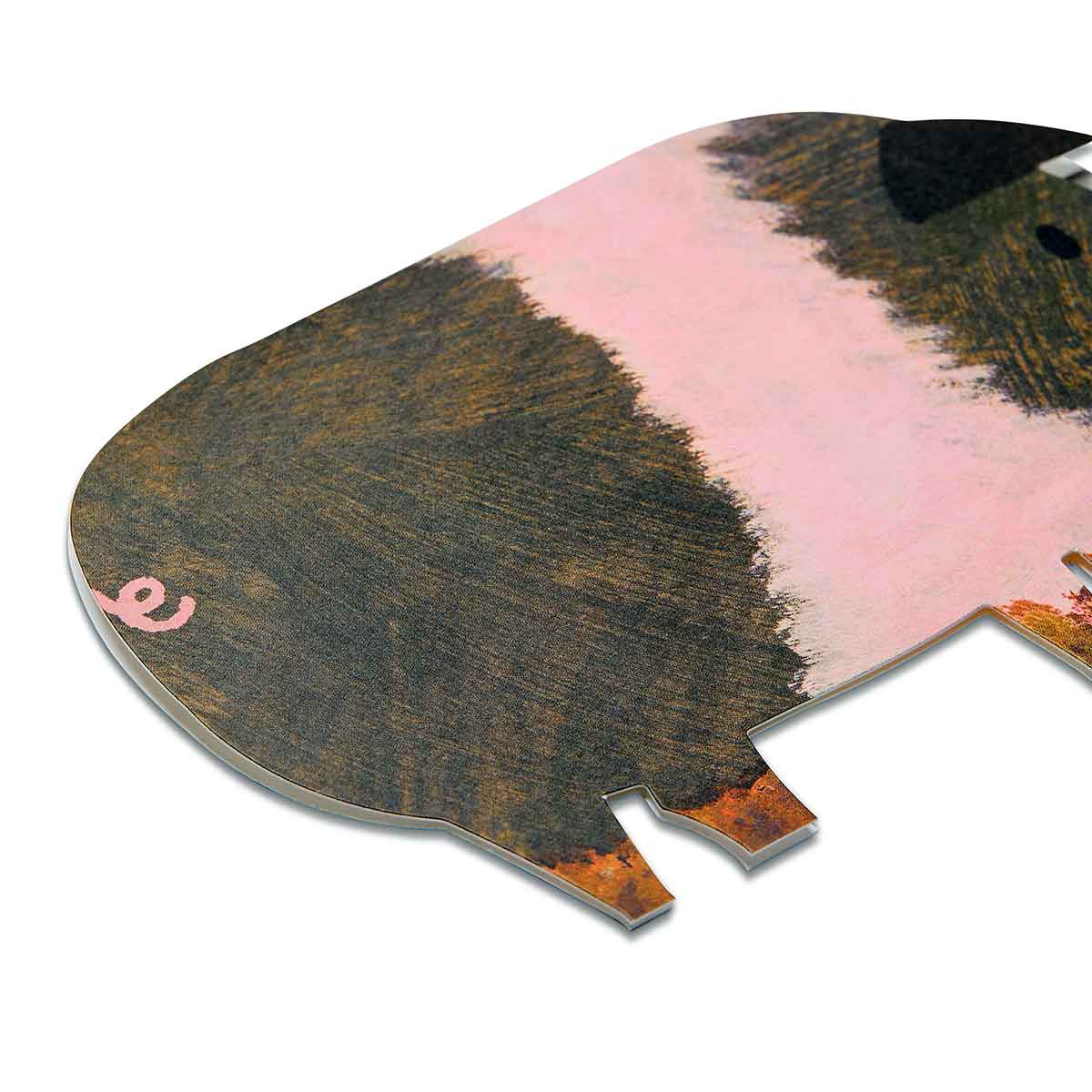 Close up of brown and pink striped pig shaped card on a white background