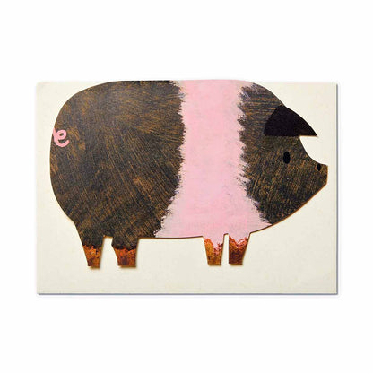 die cut saddleback shaped pig greetings card on top of ivory coloured envelope