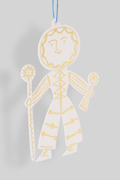 Decorative Sun Folk ornament with gold detailing on a gray background