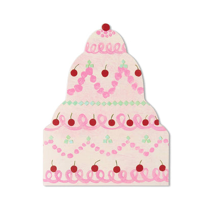 Die cut birthday cake greetings card with pink frosting and cherries on a white background.